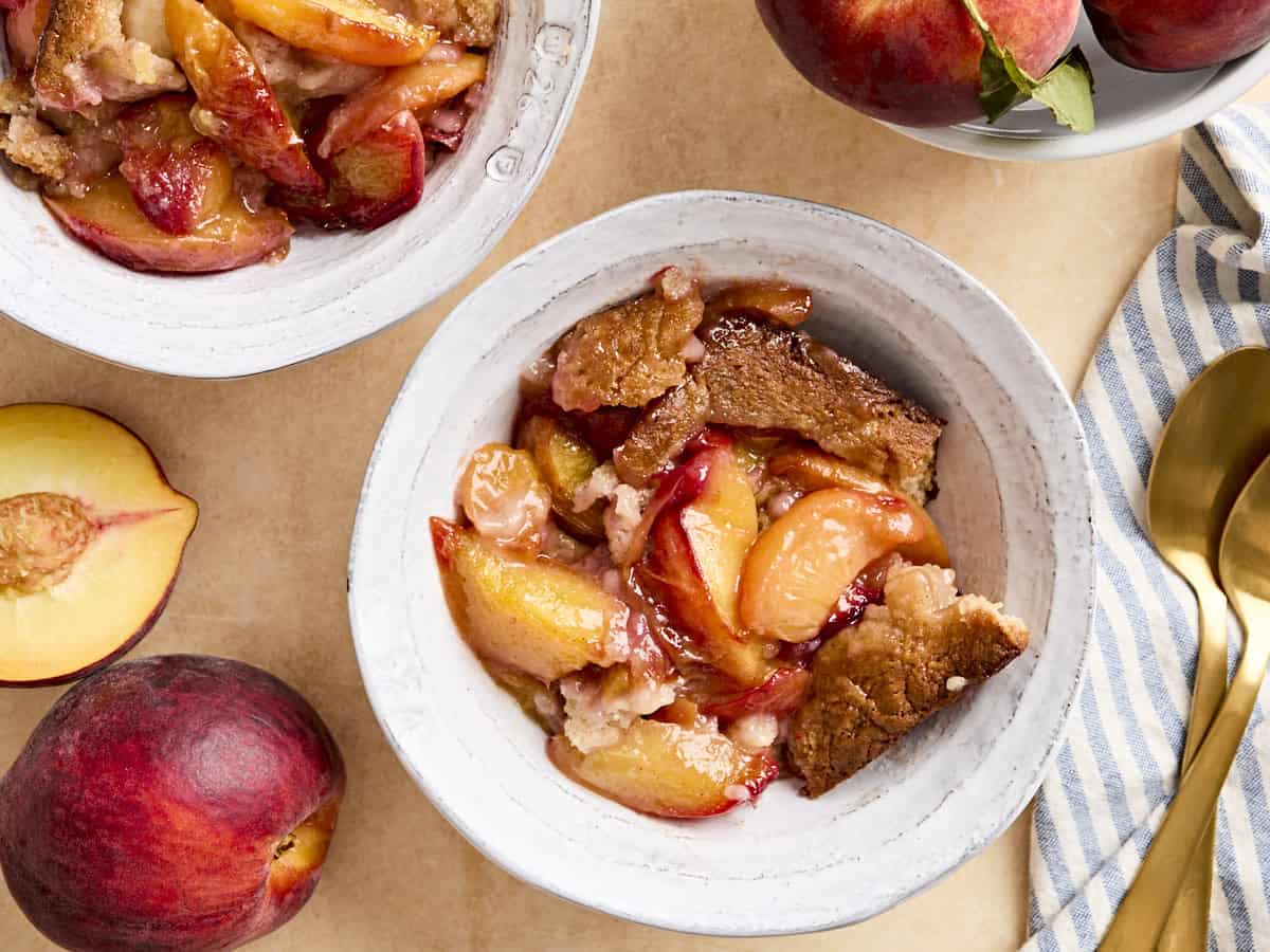 overhead view of bowls of peach cobbler.