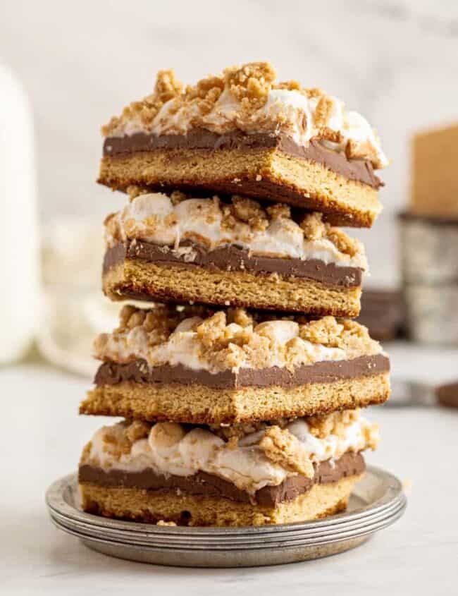 4 stacked smores bars on a small gray plate.