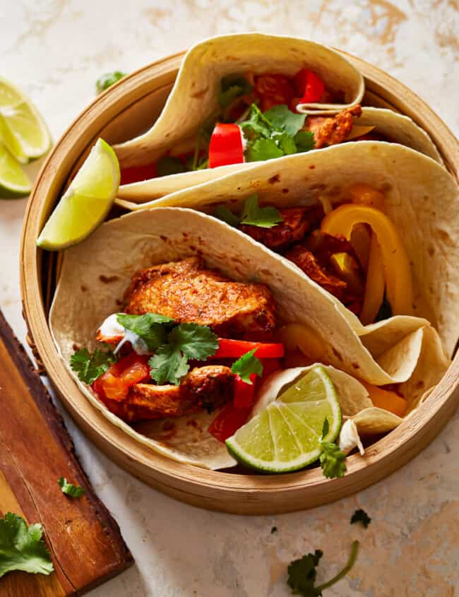 chicken tacos in a wooden bowl.