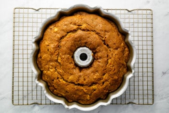 a bundt cake sitting on a cooling rack.