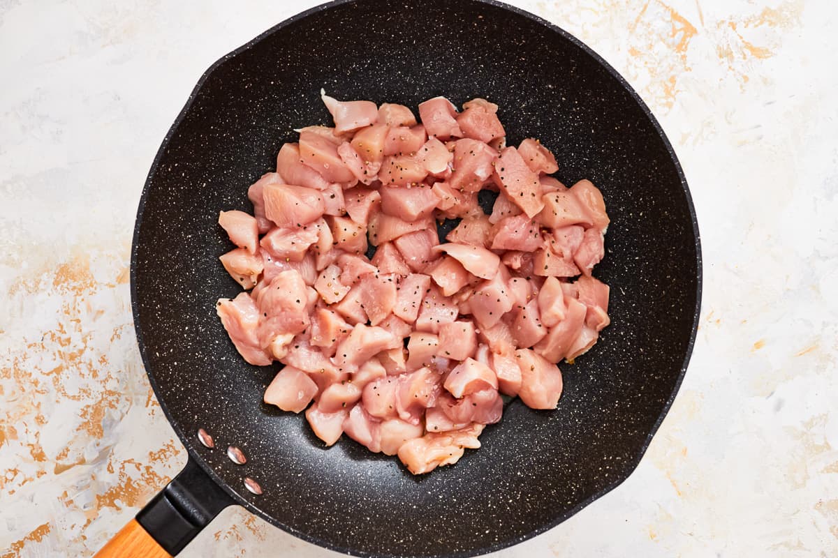 fried chicken in a frying pan.