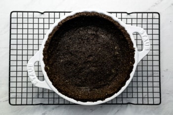 a chocolate pie on a cooling rack.