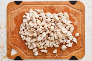 shredded chicken on a cutting board.