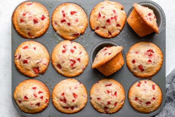 strawberry muffins in a muffin tin.