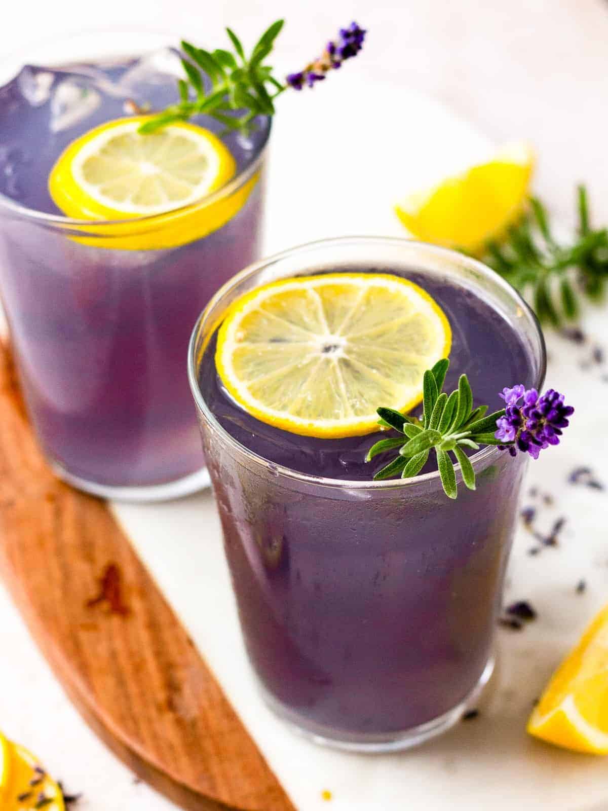 two glasses of lavender cocktail drinks