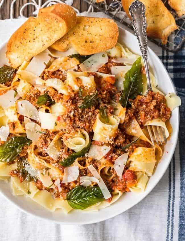 A plate of food, with Beef and noodles