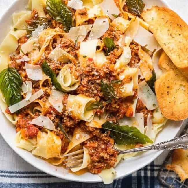 A plate of food, with Beef and noodles