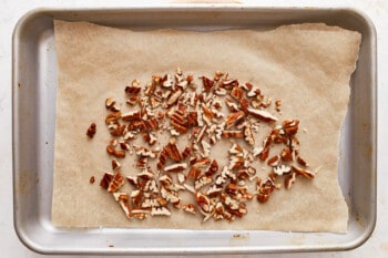 Pecans on a baking sheet.