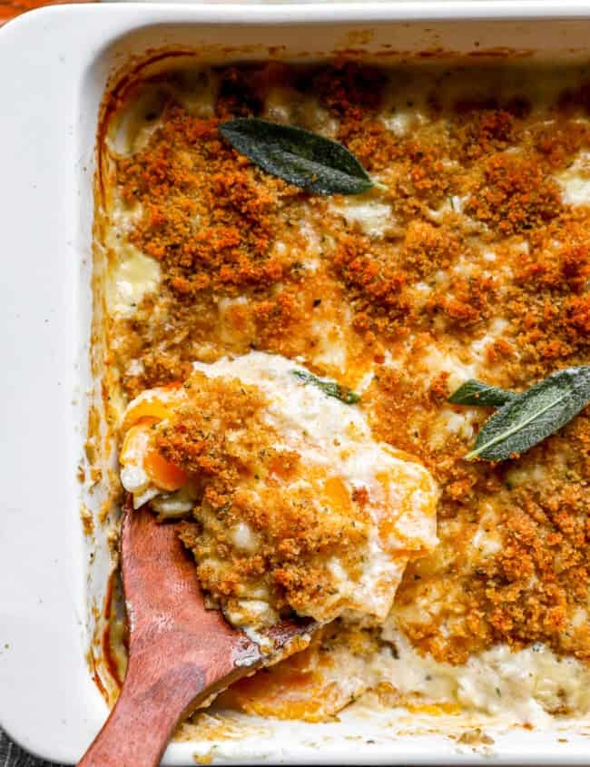 A casserole dish with a wooden spoon in it.