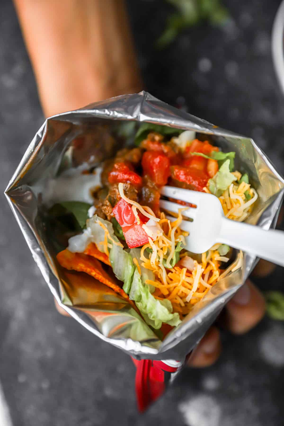 close-up view into a bag of taco ingredients and chips.