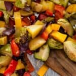 close up view of chopped roasted vegetables on a pan