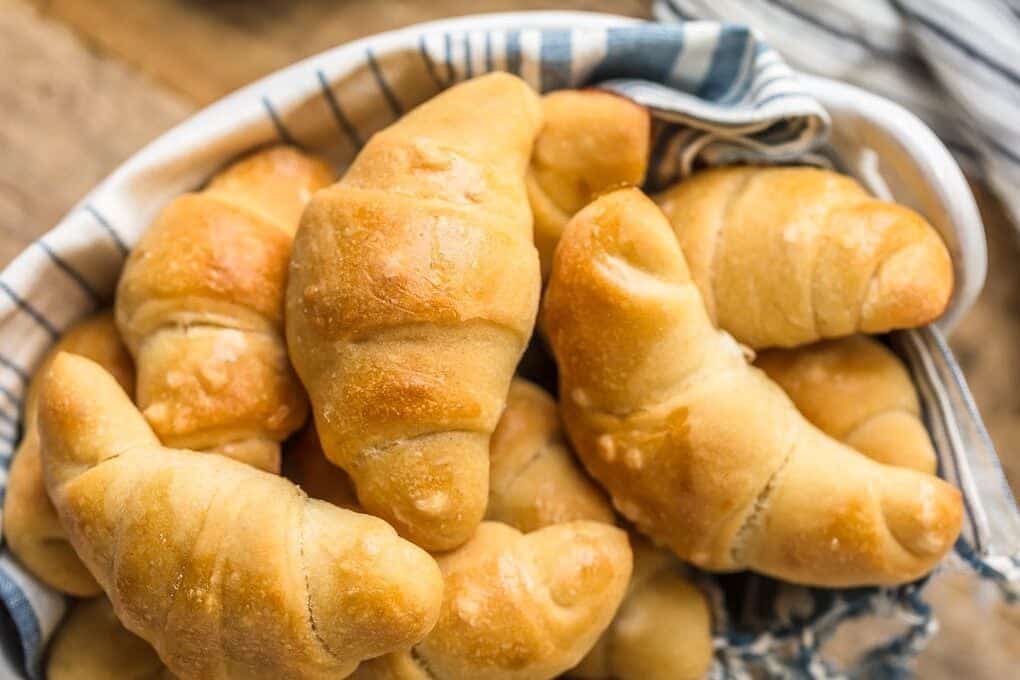 A basket of fresh crescent rolls.