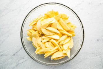 Sliced apples in a glass bowl.