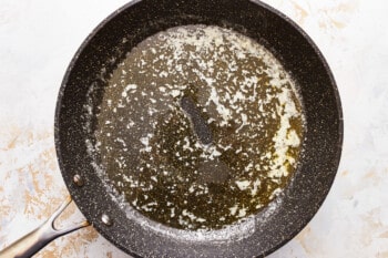 A frying pan with oil in it.