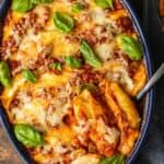 italian stuffed shells in a dish with spoon