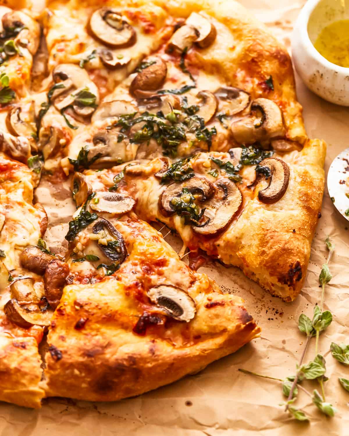 A mushroom pizza cut into slices.