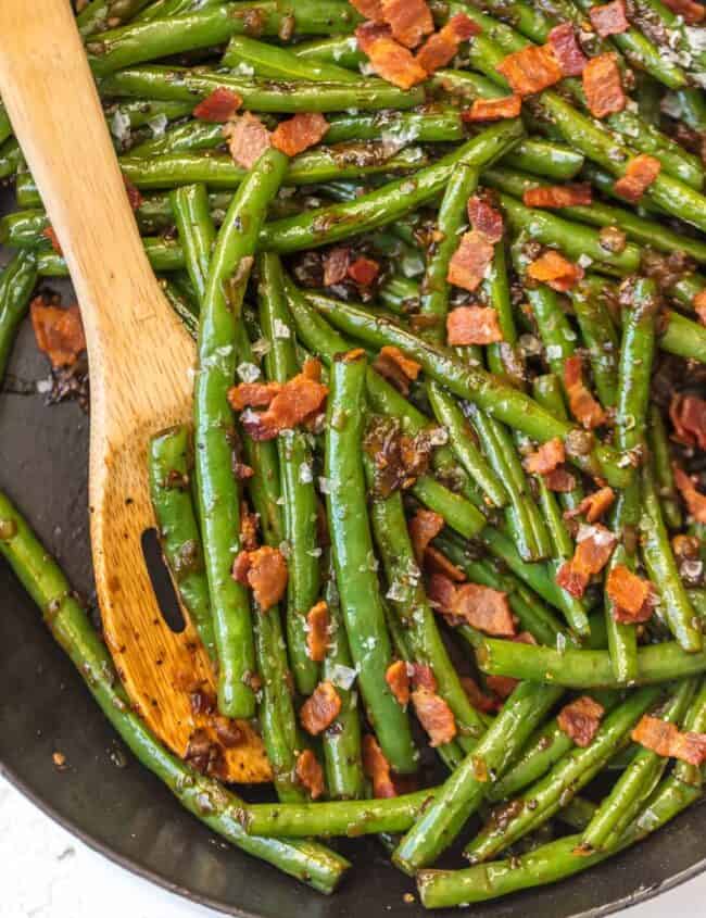 These SKILLET BOURBON BACON GREEN BEANS add some spice, flair, and beauty to any holiday table! The ultimate Thanksgiving side dish SO full of flavor, you'll be blown away!