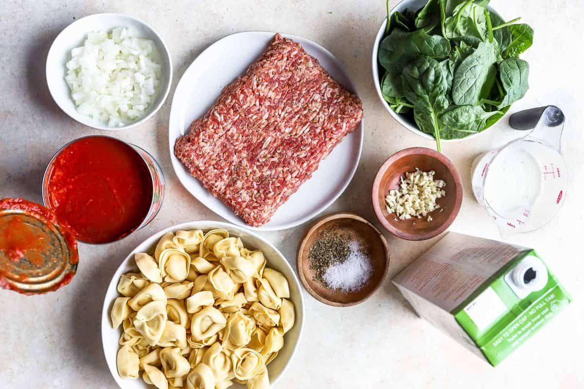 overhead view of ingredients for tortellini soup.