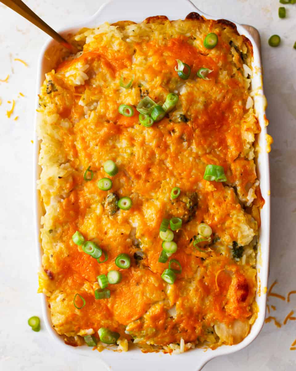 Green rice casserole topped with green onions.