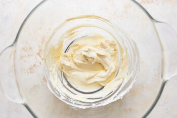 Whipped cream in a glass bowl.