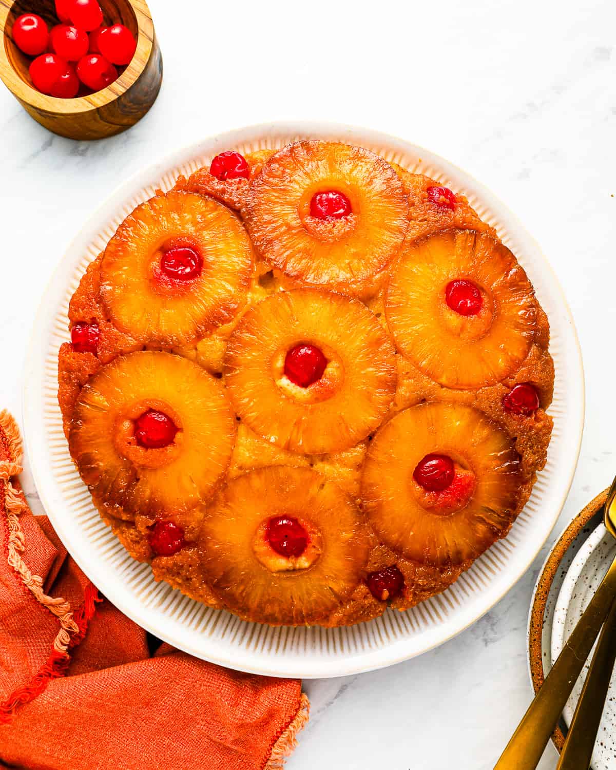 A pineapple upside down cake on a plate.