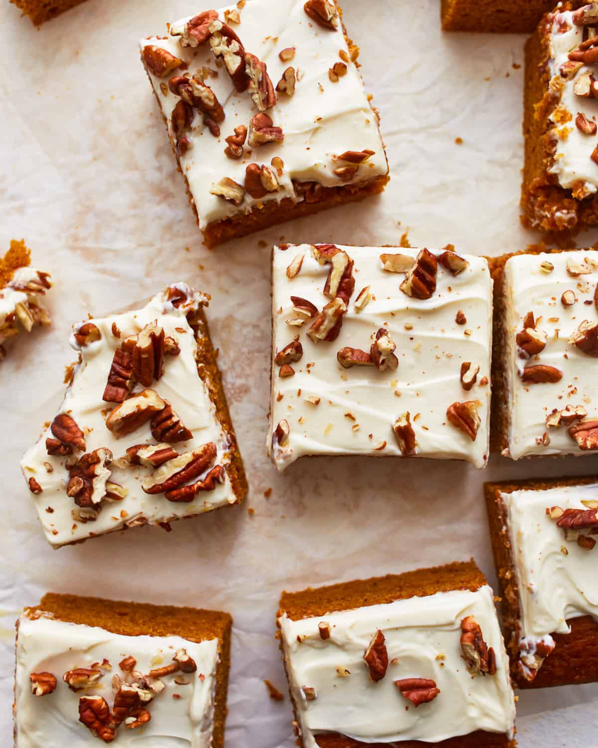 Pumpkin bars with cream cheese frosting and pecans.