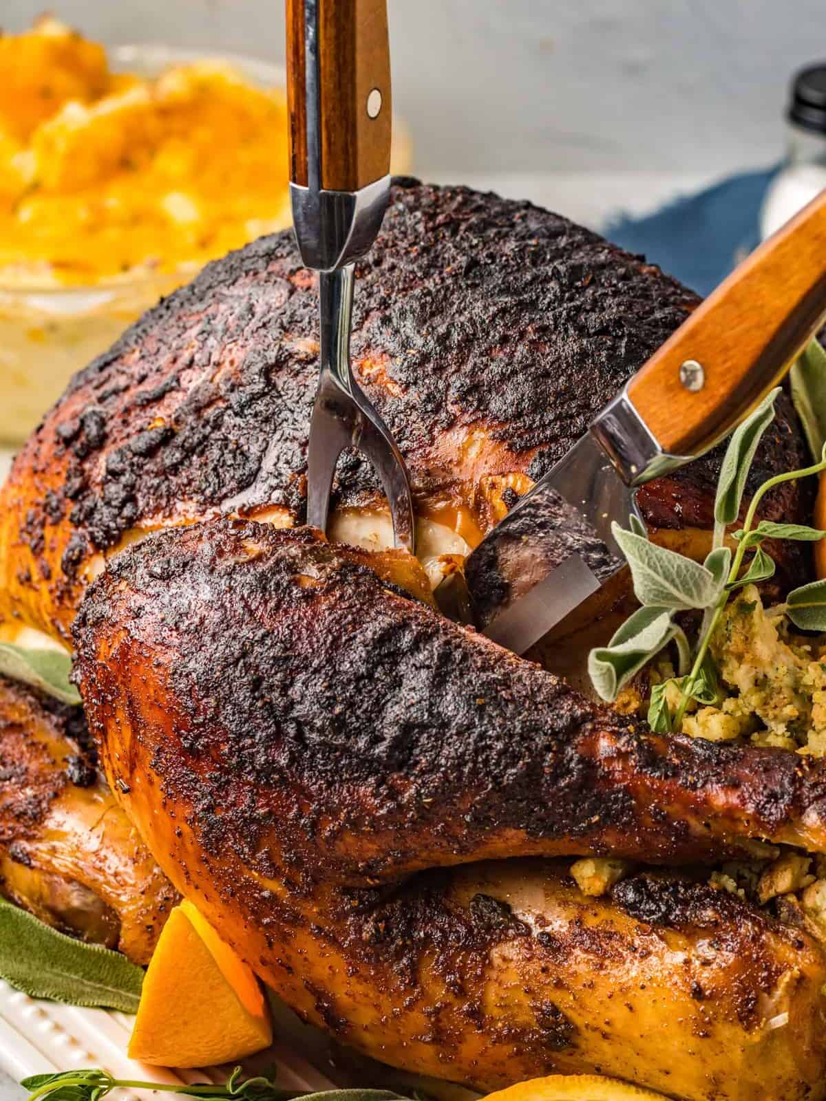 carving tools slicing a herb brined turkey.