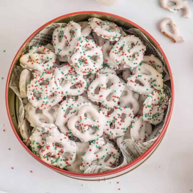 christmas pretzels in a bowl with sprinkles.