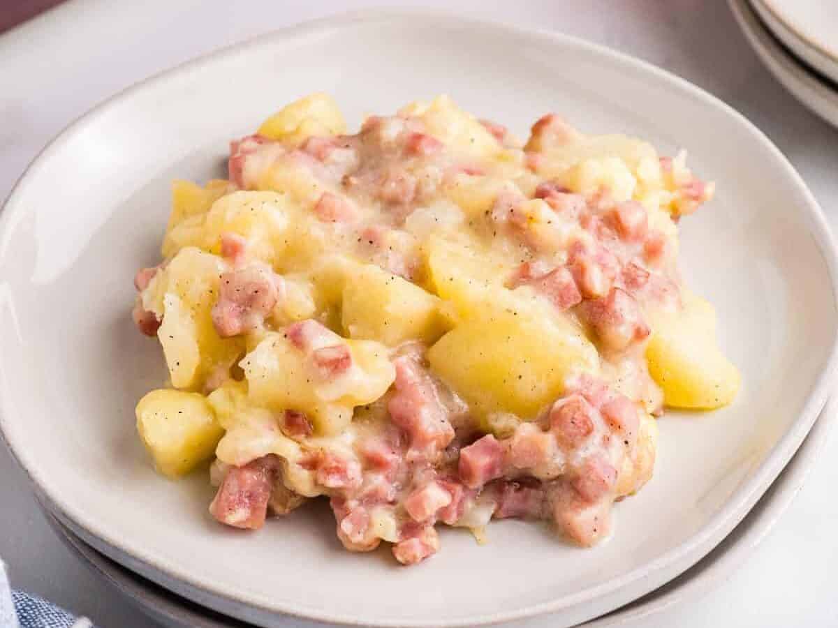 ham and potato casserole on a white plate