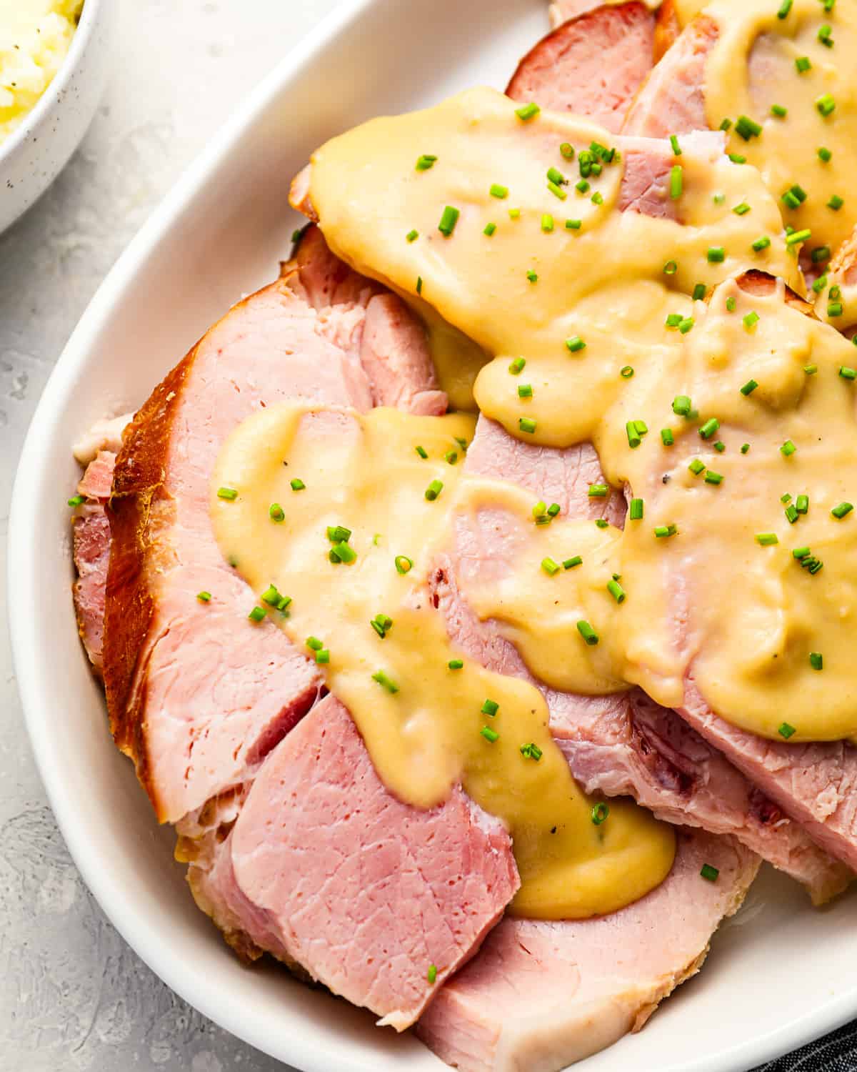 Slices of ham covered in ham gravy.