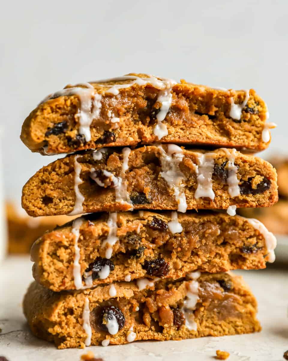 A stack of hermit cookies drizzled with icing.