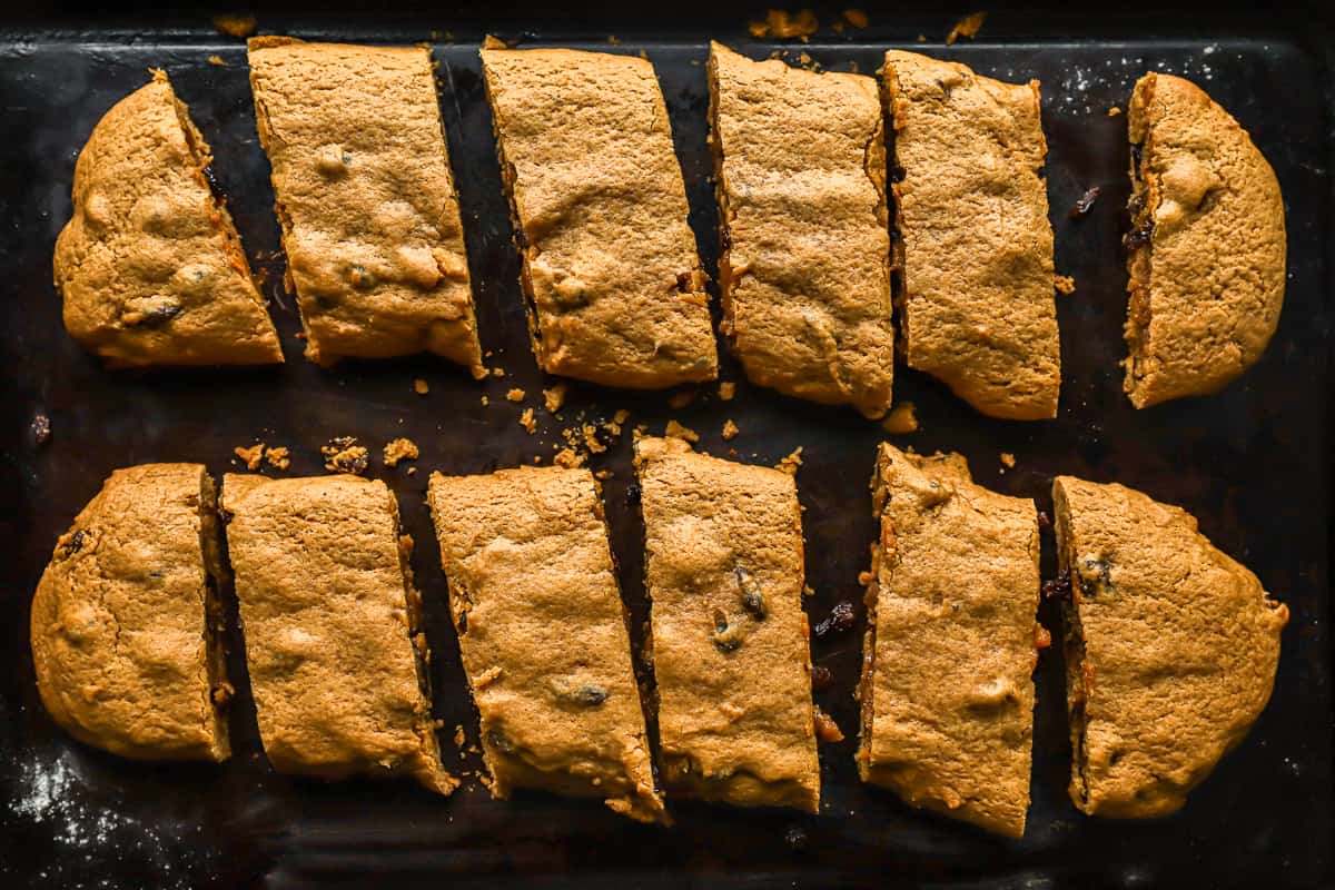 A baking sheet with sliced hermit cookies on it.