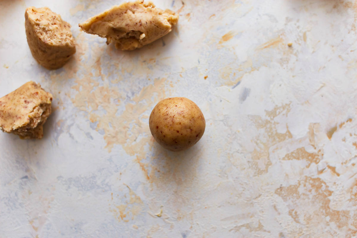 Cookie dough shaped into a ball.