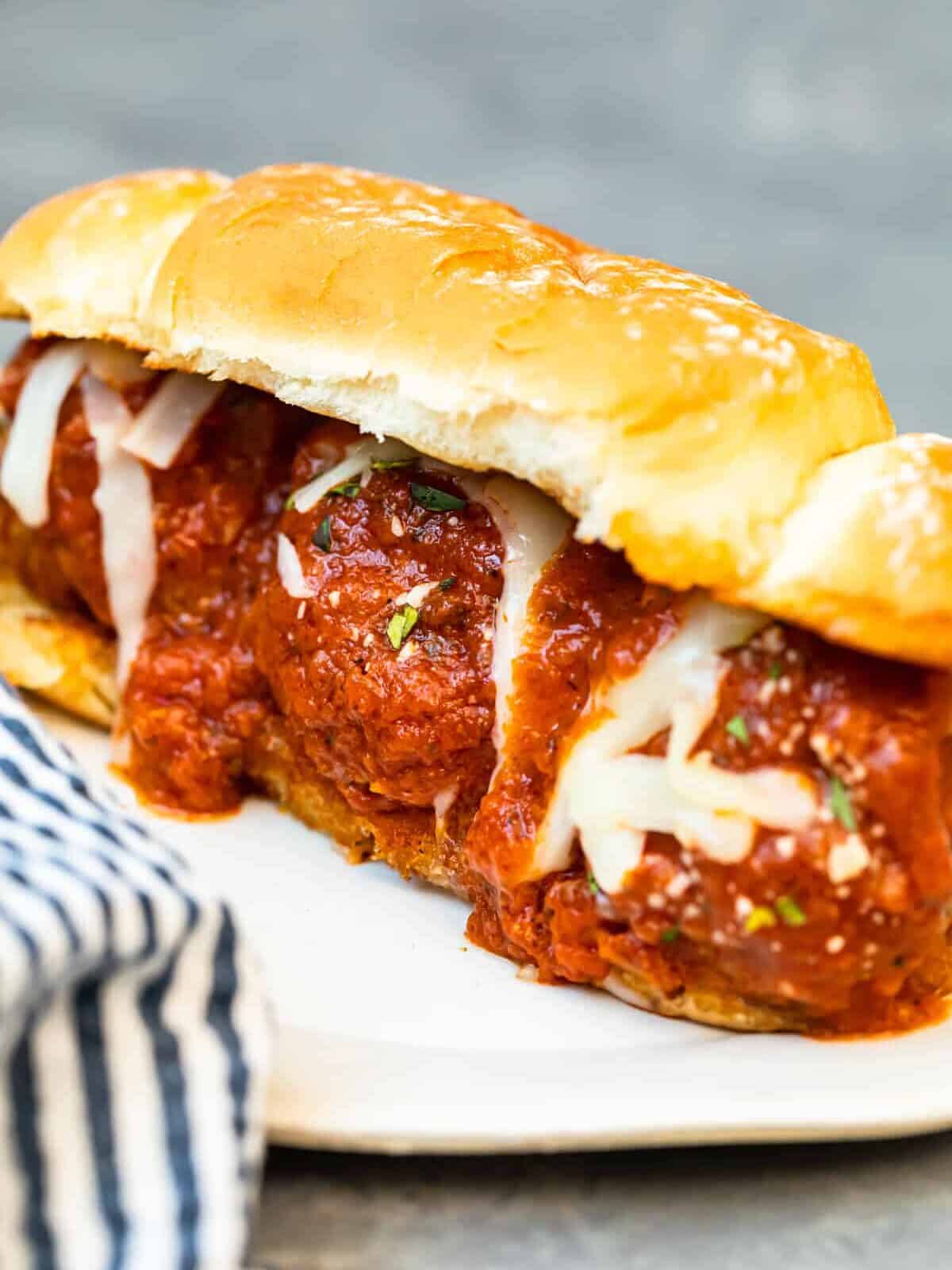 a meatball sub sandwich on a plate.