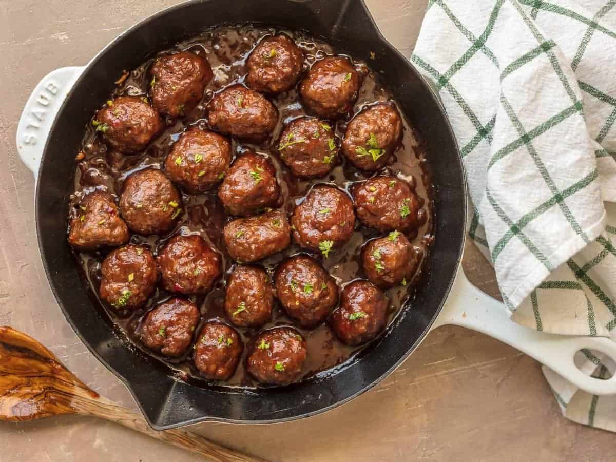 SWEET & SPICY CRANBERRY COCKTAIL MEATBALLS are the perfect holiday appetizer! Cooked in a cranberry pepper jelly sauce; SO delicious! The best Thanksgiving, Christmas, or New Years Eve appetizer!