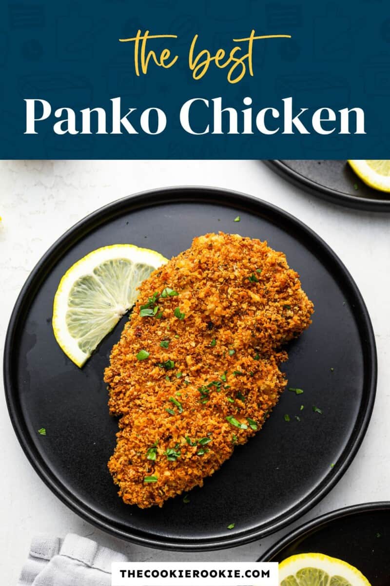 The best panko chicken on a black plate.