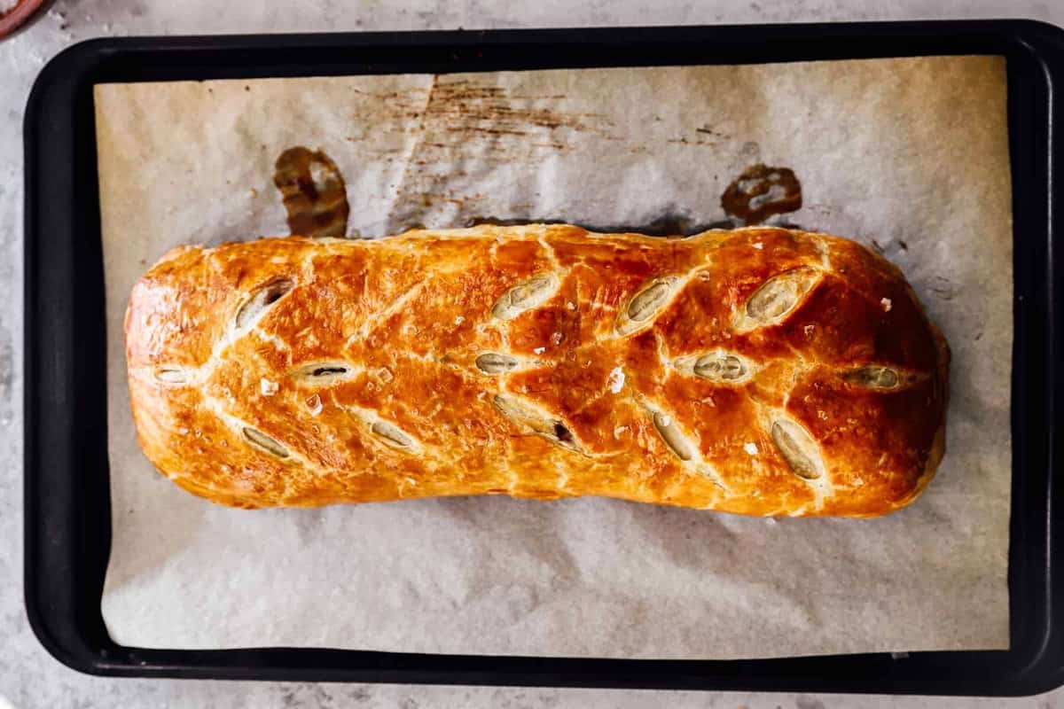 baked beef wellington on a baking sheet.