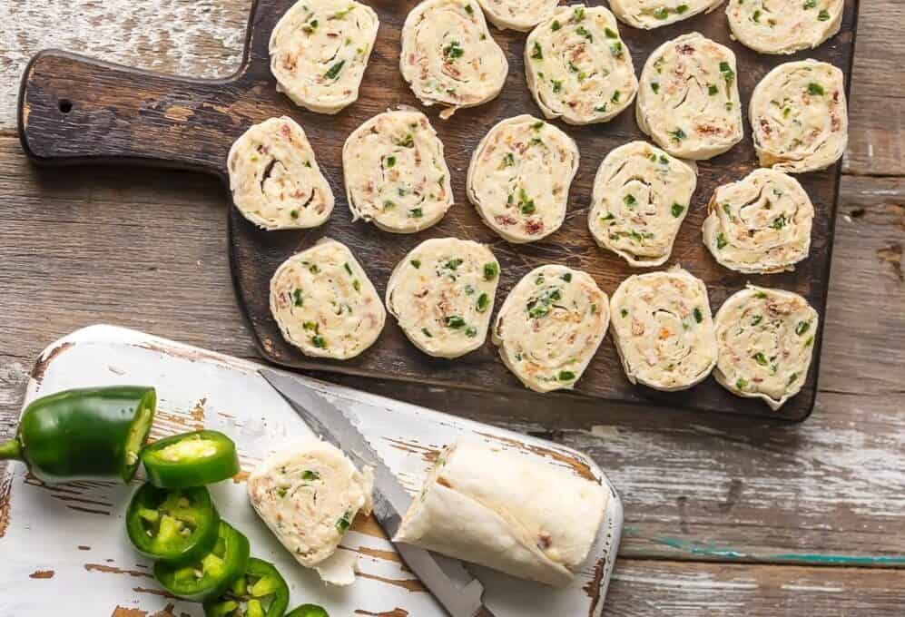 Jalapeno Popper Pinwheels on wood serving board