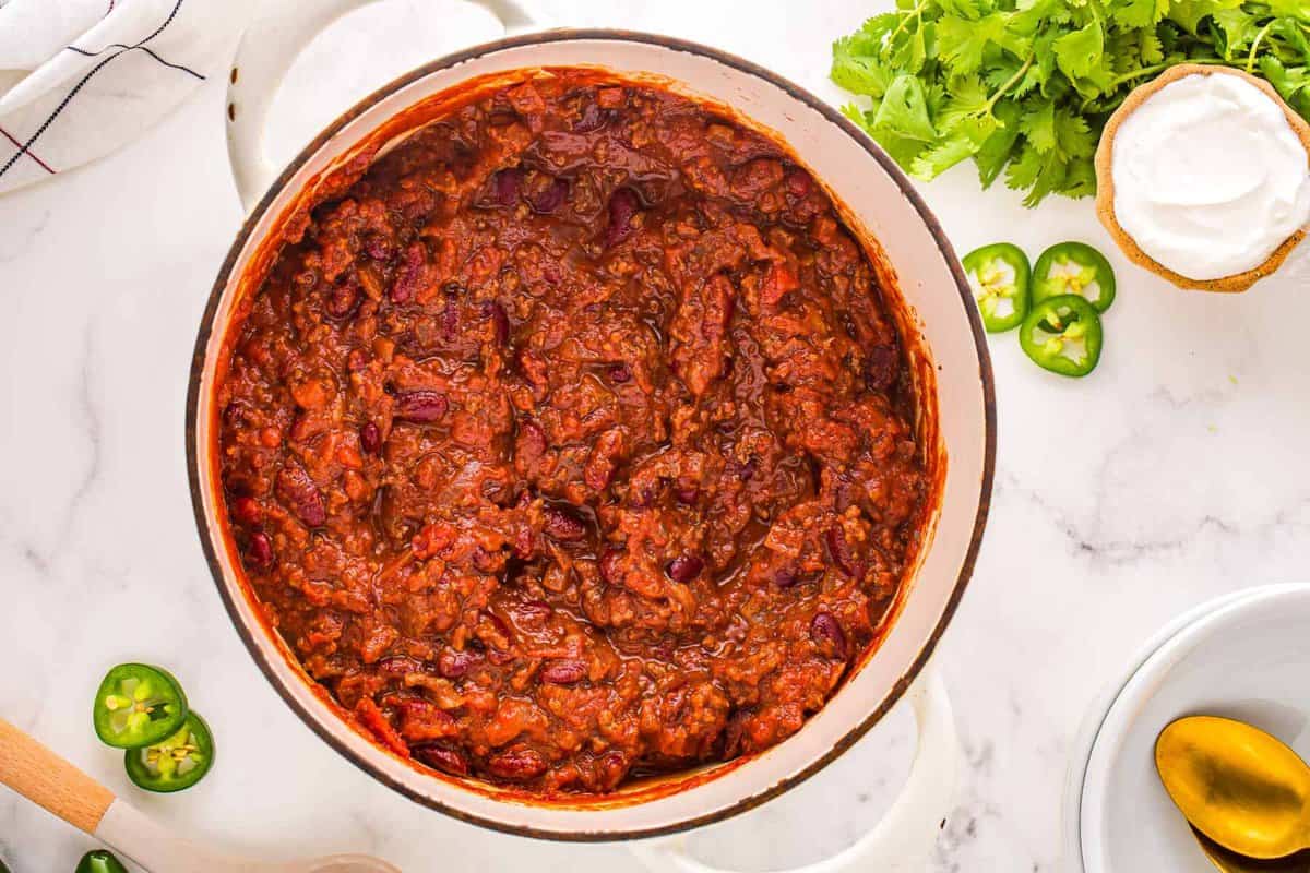 overhead view of chili con carne in a dutch oven.