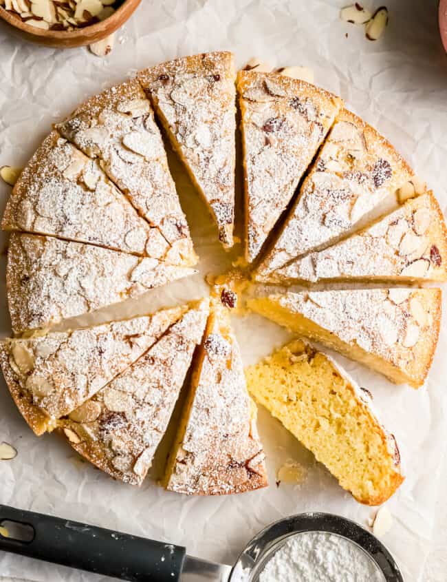 A moist almond cake topped with a delicate dusting of powdered sugar.