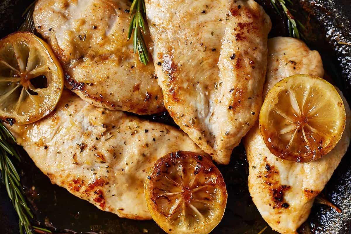 up close lemon chicken in a skillet