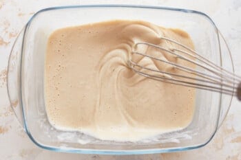 Beer-battered fish batter with a whisk in it.