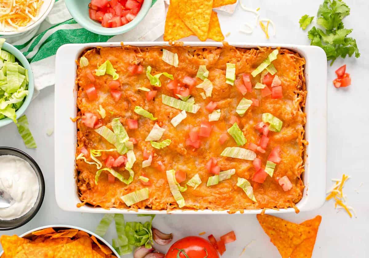 layered doritos casserole in baking dish