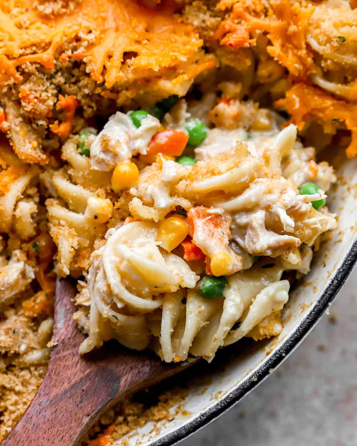 close up of a spoonful of chicken noodle casserole.