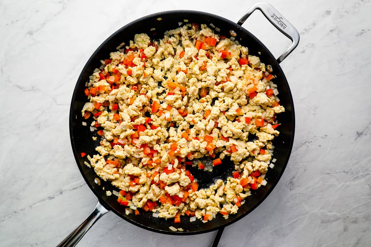 cooked ground chicken and veggies in a skillet.