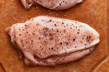 seasoned raw chicken breasts.