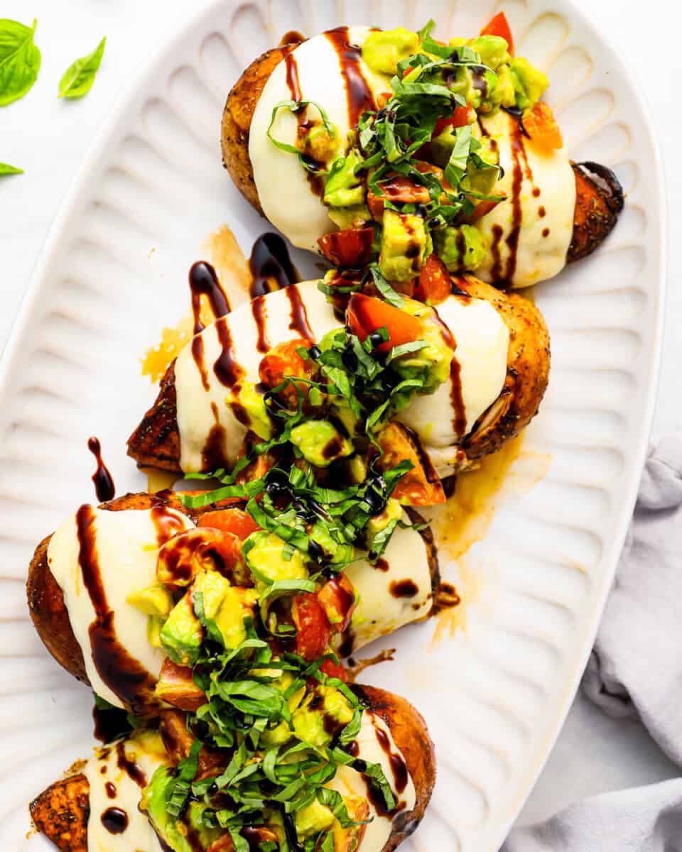 California grilled chicken breasts topped with avocado, mozzarella, tomatoes, and balsamic glaze.