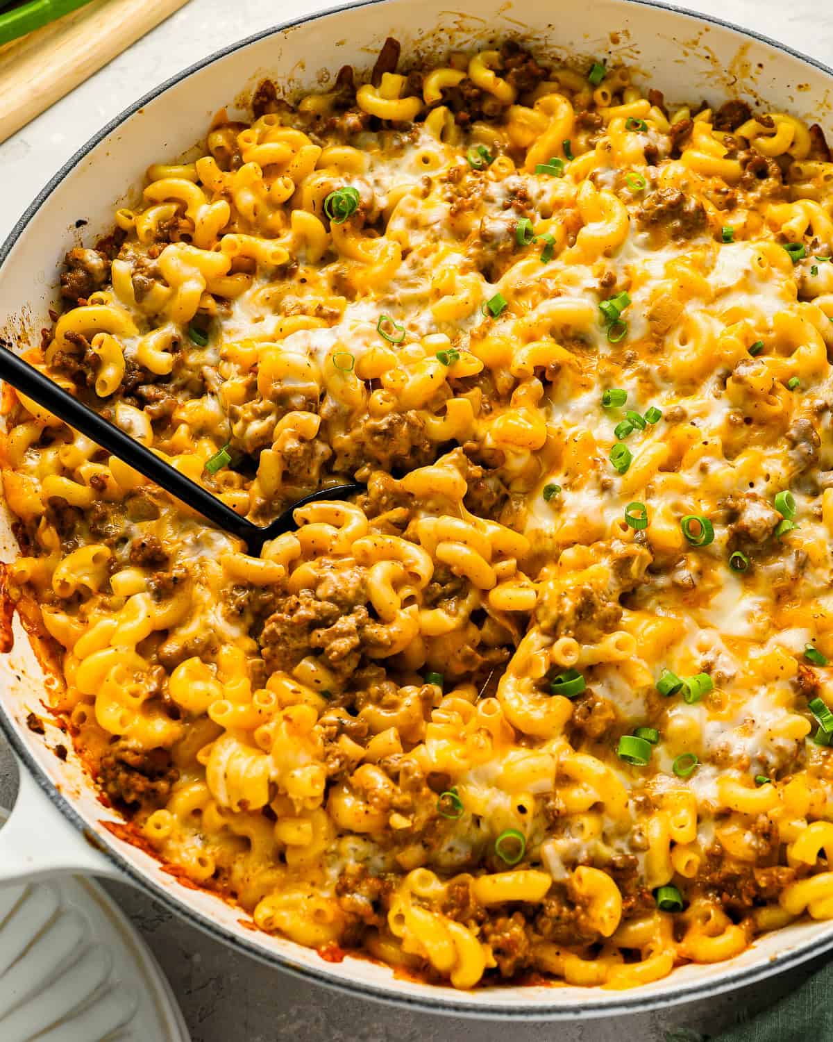 A pot of cheeseburger casserole stuffed with ground beef, cheese, and macaroni.