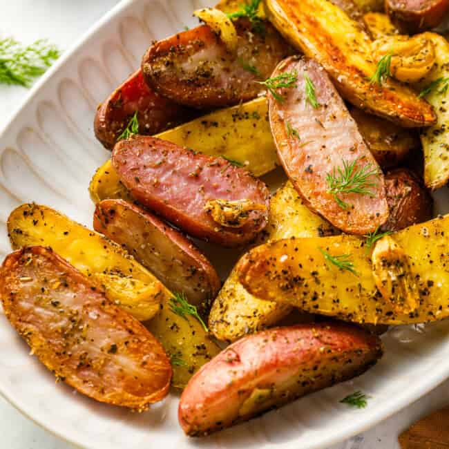 fingerling potatoes on a white serving platter.