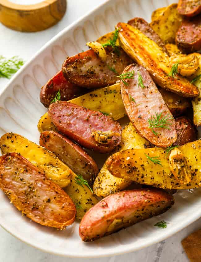 fingerling potatoes on a white serving platter.